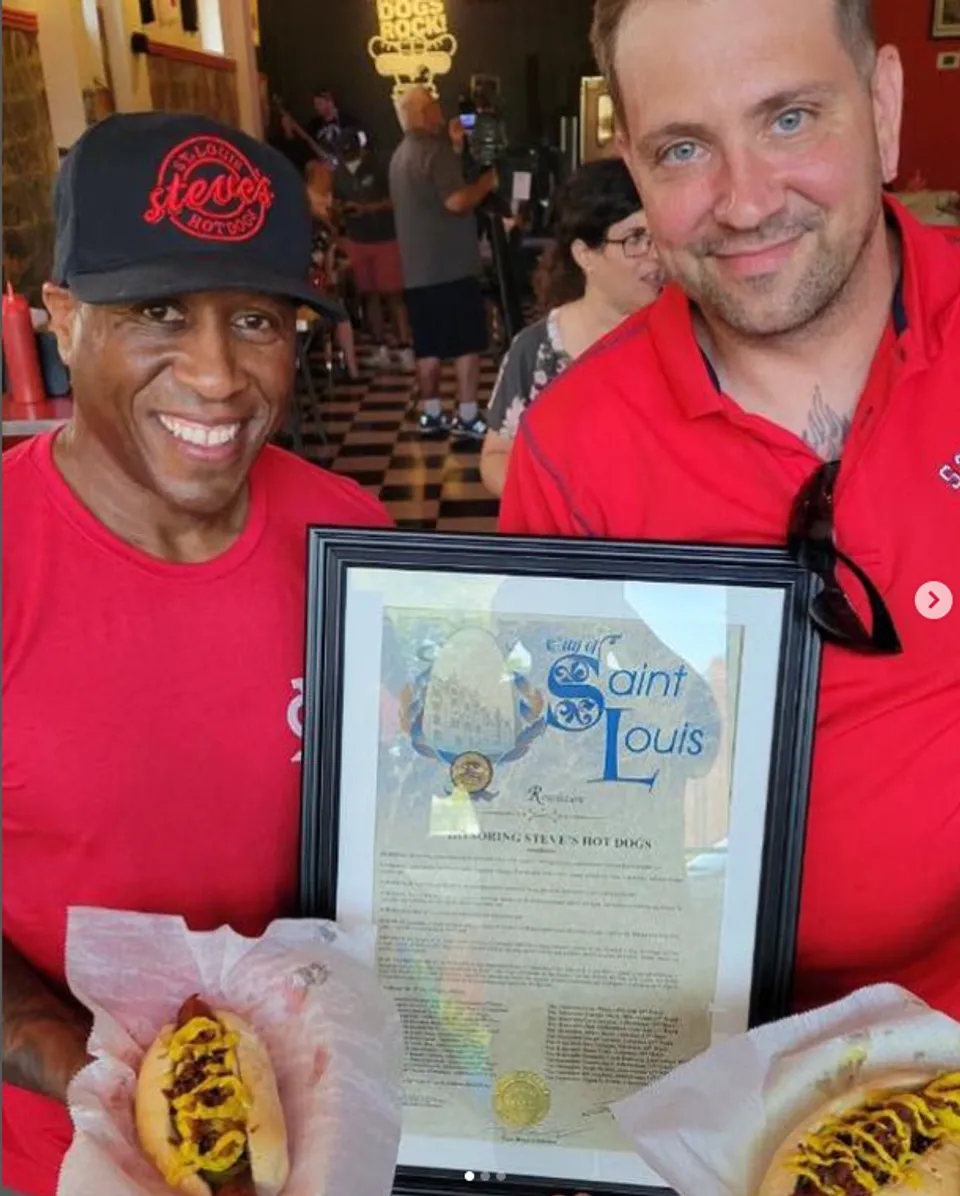 Steve Ewing and Chef Joe Zeable hold the proclamation from the City of St. Louis.