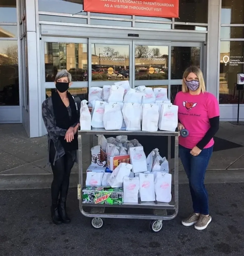 Nurses stand with donated meals during COVID - part of the Steve's Hot Dogs Feed the People Program